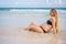 Radiant pregnant woman in a swimsuit, amid the stunning backdrop of a turquoise sea. Serene beauty of maternity by the