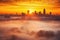a radiant sunrise illuminating a foggy cityscape