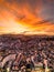 Radiant Sunset Skyline: Captivating Red Sky View of Da Lat City, Vietnam with a Stunning Blend of Colors between Cityscape and Sky