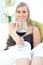 Radiant woman drinking red wine