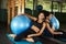 A radiant young black woman smiling brightly relaxing after workout