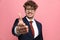 Radiant young businessman in navy blue suit shaking hand