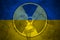 Radiation sign on the background of flag of Ukraine. The risk of nuclear war and radiation pollution