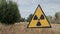 Radiation sign near forbidden Red Forest. A sign warning the nuclear risk in Chernobyl exclusion zone, Ukraine