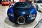 Radiator grill headlights at blue vintage classic car auto
