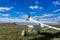 A radio-controlled unmanned aircraft stands on the runway of an airfield