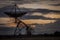 Radio Telescope Silhouette Pointing at the Sky at Dusk