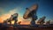 Radio telescopes aligned in the sky at sunset
