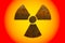 Radioactive ionizing radiation nuclear danger symbol constructed of 3D rusty metal grungy texture and isolated on yellow and red