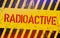 Radioactive warning sign. Nuclear power danger symbol with yellow and hazard black stripes. Illustratio.