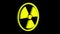 Radioactive yellow sign rotate isolated on black background