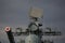 Radioelectronic armament of a Russian destroyer against the background of a dark cloudy sky