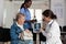 Radiologist doctor analyzing medical radiography with elderly sick woman