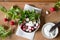 Radish with fresh herbs and sour cream. Vitamin salad with parsley and green onions. Healthy food. Top view.