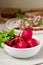 Radish and lettuce leaves on a background of sandwiches and slices of rye bread. Rustic style.