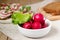 Radish and lettuce leaves on a background of sandwiches and slices of rye bread. Rustic style.