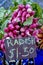 Radishes in a farmers market with for sale sign
