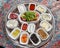 Ð¢raditional turkish breakfast-cheese, olives, vegetables, yogurt, candied fruit, jam