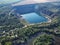 Radon lake near the Southern Bug river on a sunny summer day. Picturesque landscape from a bird`s eye view. Flooded granite quarr