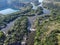 Radon lake near the Southern Bug river on a sunny summer day. Picturesque landscape from a bird`s eye view. Flooded granite quarr