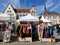 Raekoja Plats marketplace in Tallinn, Estonia. Traditional clothes and handicrafts for sale. Tourist attraction.