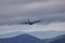 RAF Royal Air Force Lockheed C-130 Hercules transport plane carrying out low level flying in the United Kingdom