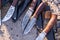 Ð¡raft handmade hunting knives styled on damascus steel, are lying on the concrete floor