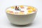 Rafting in a bowl of colorful cereal with milk. Healthy breakfast concept