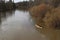 Rafting on the river. tourists swim in the forest river in the flood on a canoe. kayaking on high water in the spring forest.