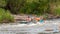 Rafting trip. Two rowers are rafting down the river in a rubber inflatable boat