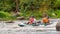 Rafting trip. Two rowers are rafting down the river in a rubber inflatable boat