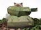 Ragdoll cat peeping out of mini army tank