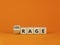 Rage or courage symbol. Turned a cube and changed the word `rage` to `courage`. Beautiful orange background. Copy space. Busin