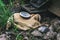 Ragged gas mask among stones