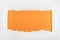 Ragged textured white paper with curl edges on orange background.