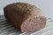 Ragi bread or Finger millet bread. Loaf of home baked bread with finger millet flour sprinkled with fax seeds on top