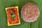 Ragi mudde with spicy red chutney on the banana leaf