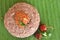 Ragi mudde with spicy red chutney on the banana leaf