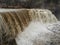 Raging creek spring waters of Ludlowville Falls