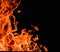 Raging flames red fire black background