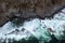raging ocean waters from a drone turquoise waters ocean rocks sky
