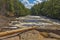 Raging River Flowing Past a Rocky Island