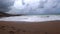 Raging waves of a stormy sea on a sandy beach. Stormy weather