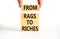 Rags or riches symbol. Concept words From rags to riches on wooden blocks. Beautiful white table white background. Businessman