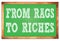 FROM RAGS TO RICHES words on green wooden frame school blackboard