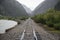 Raid Road tracks towards mountains and Animas River, Durango and Silverton Narrow Gauge Railroad, Silverton, Colorado, USA