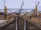 Rail road tracks under the gantry cranes on the berth of sea merchant port
