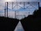 Rail track reflecting blue sky and railroad infrastructure