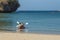 Railay, Thailand - February 19, 2019: A young couple, a man and a girl, swim in a kayak from the shore in the morning. They are