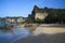 RAILEY KRABI, THAILAND - JANUARY 3. 2017: View on secluded beach with high steep limestone cliffs and traditional thai long-tail
